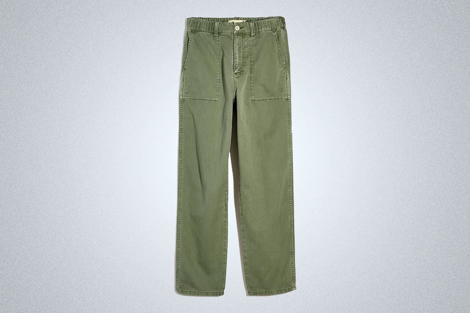 a pair of green chinos from Madewell on a grey background