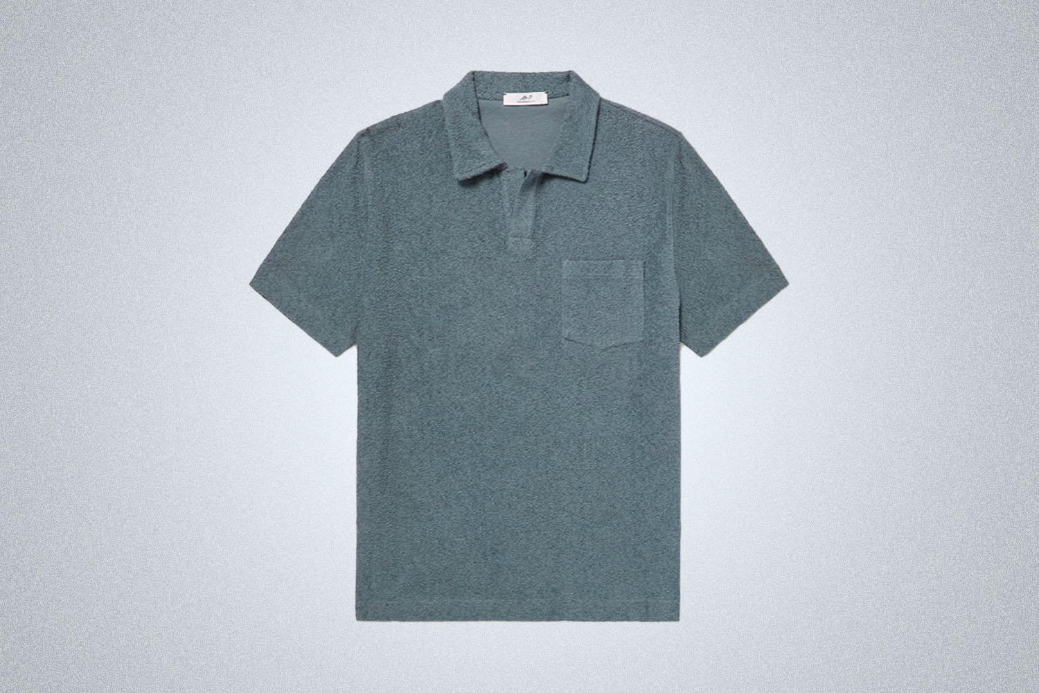 a blue terry polo from Mr P on a grey background