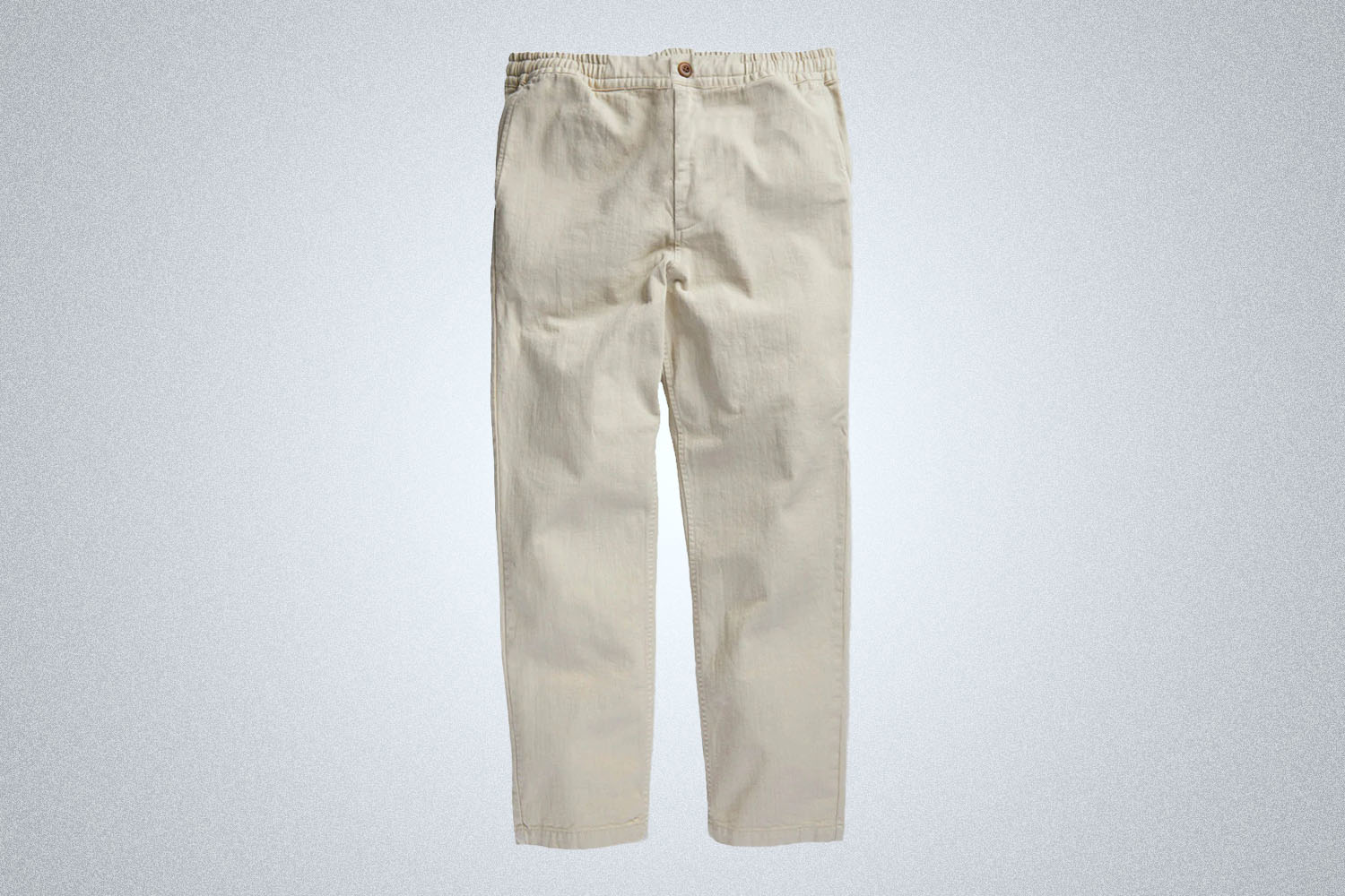 a pair of white outerknown jeans on a grey background