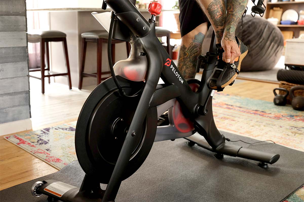 A detail of Brody Longo strapping his foot into his Peloton exercise bike pedal before he works out on April 16, 2021 in Brick, New Jersey