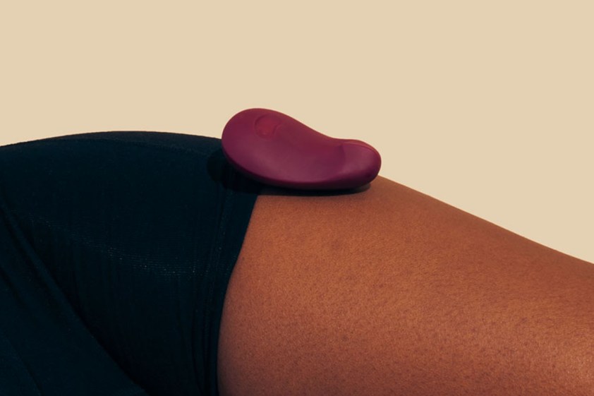 pom flexible vibrator on a womans leg