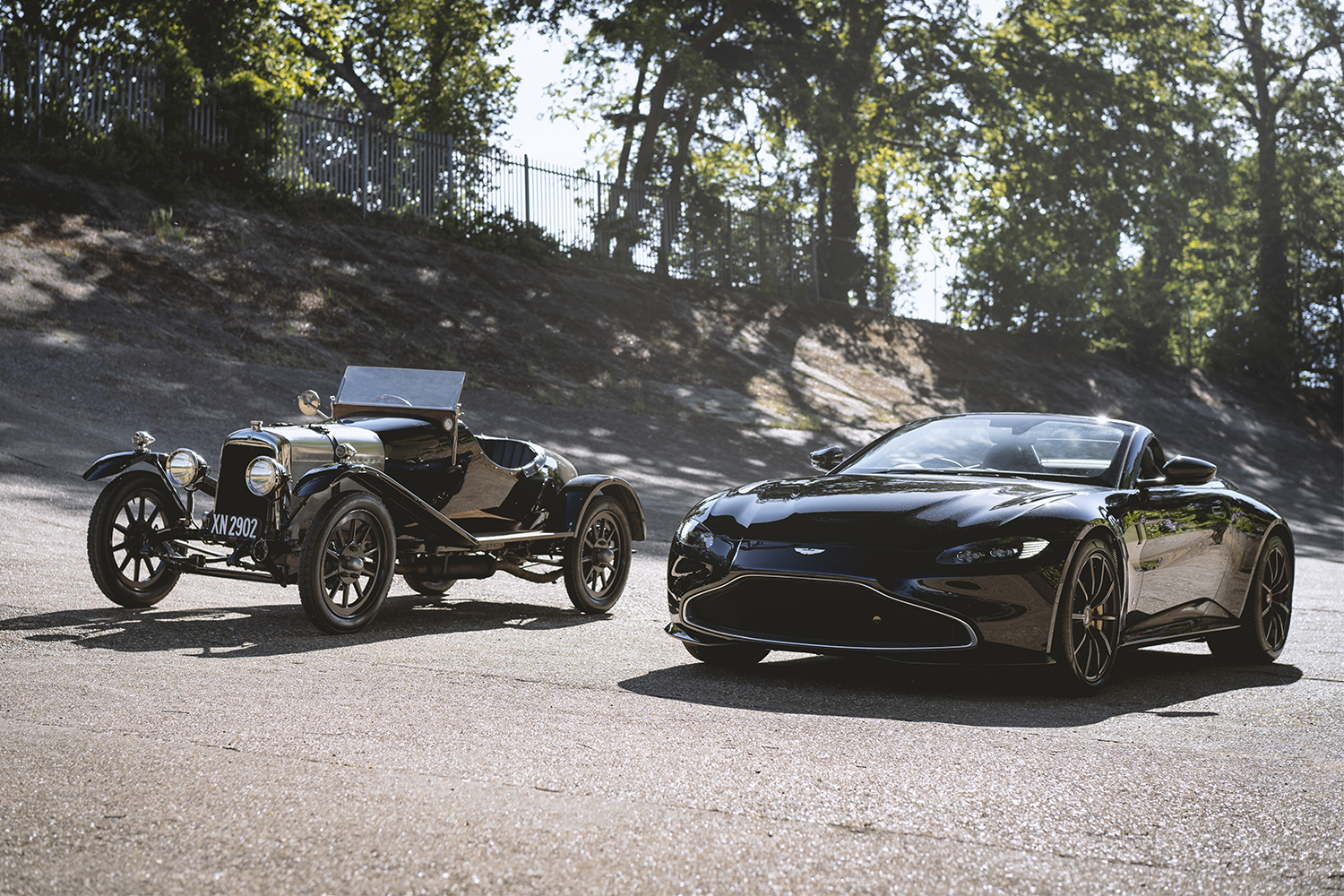The Aston Martin A3, the automaker's oldest surviving car, next to a custom Vantage Roadster which pays tribute to the 1921 car