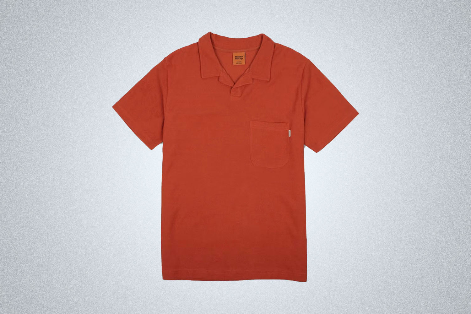 a red terry polo from Rythem on a grey background