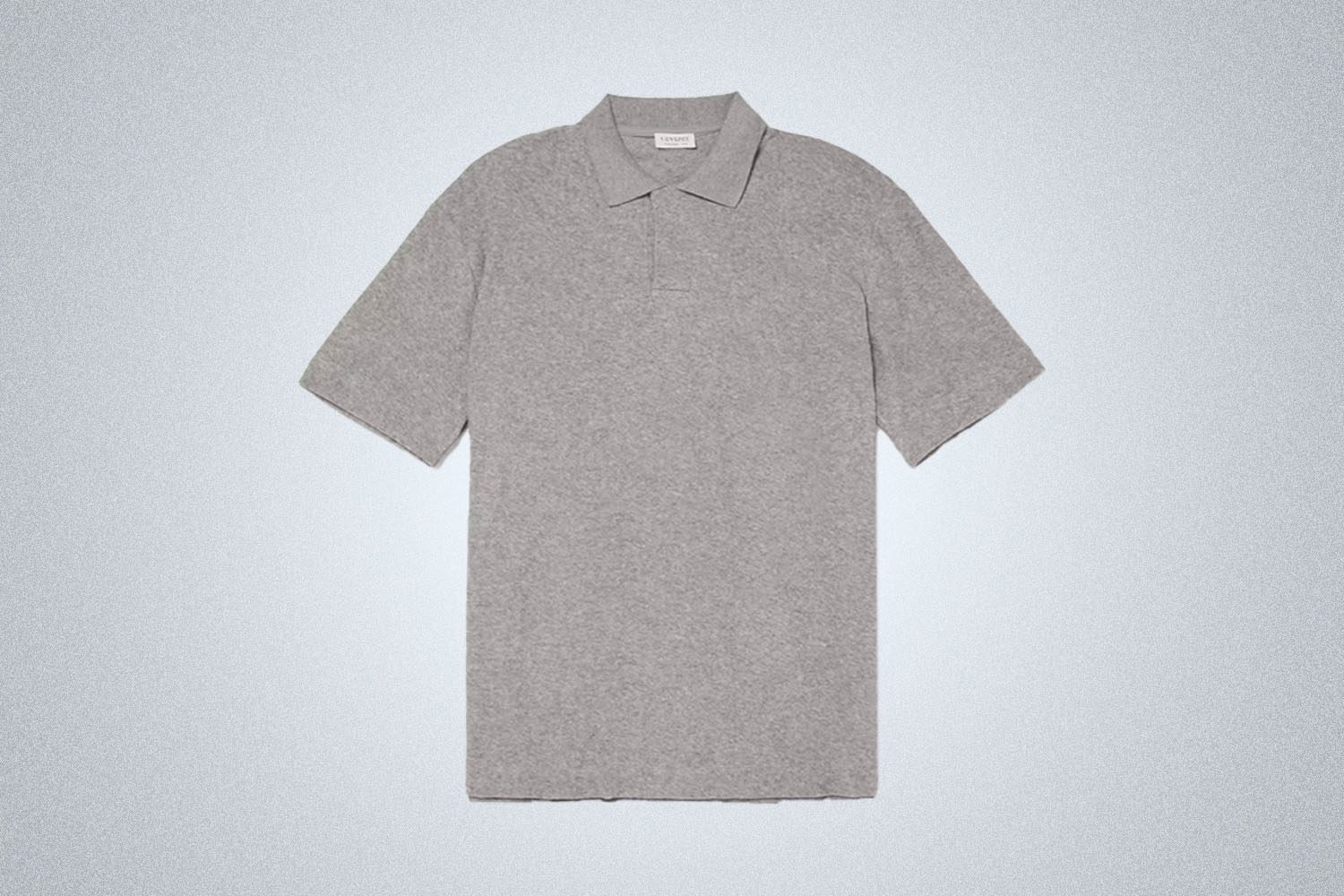 a grey terry polo from Sunspel on a grey background