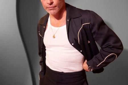 a photo of Chris Pine wearing a white tank top