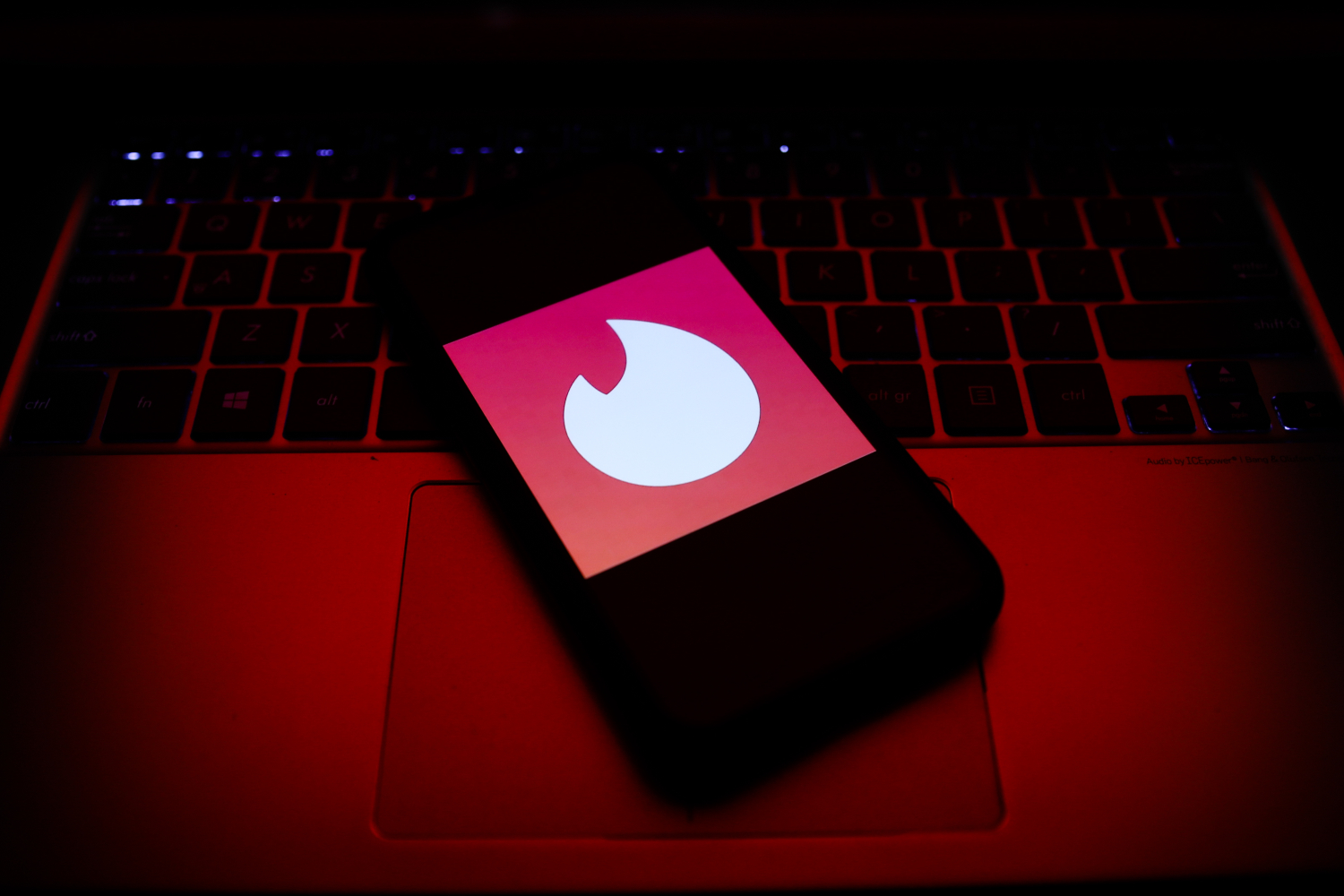 Tinder logo displayed on a phone screen is seen in this illustration photo