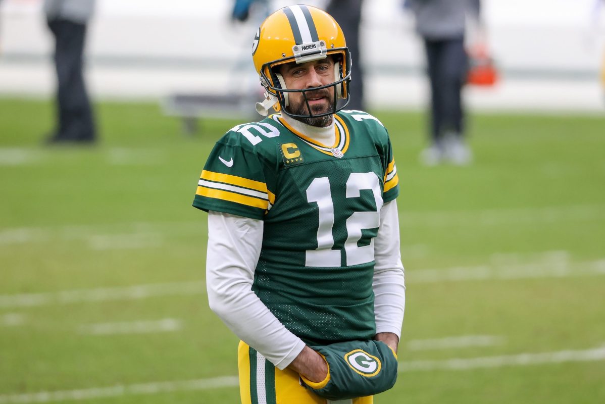 Aaron Rodgers of the Packers warms up before the NFC Championship game.