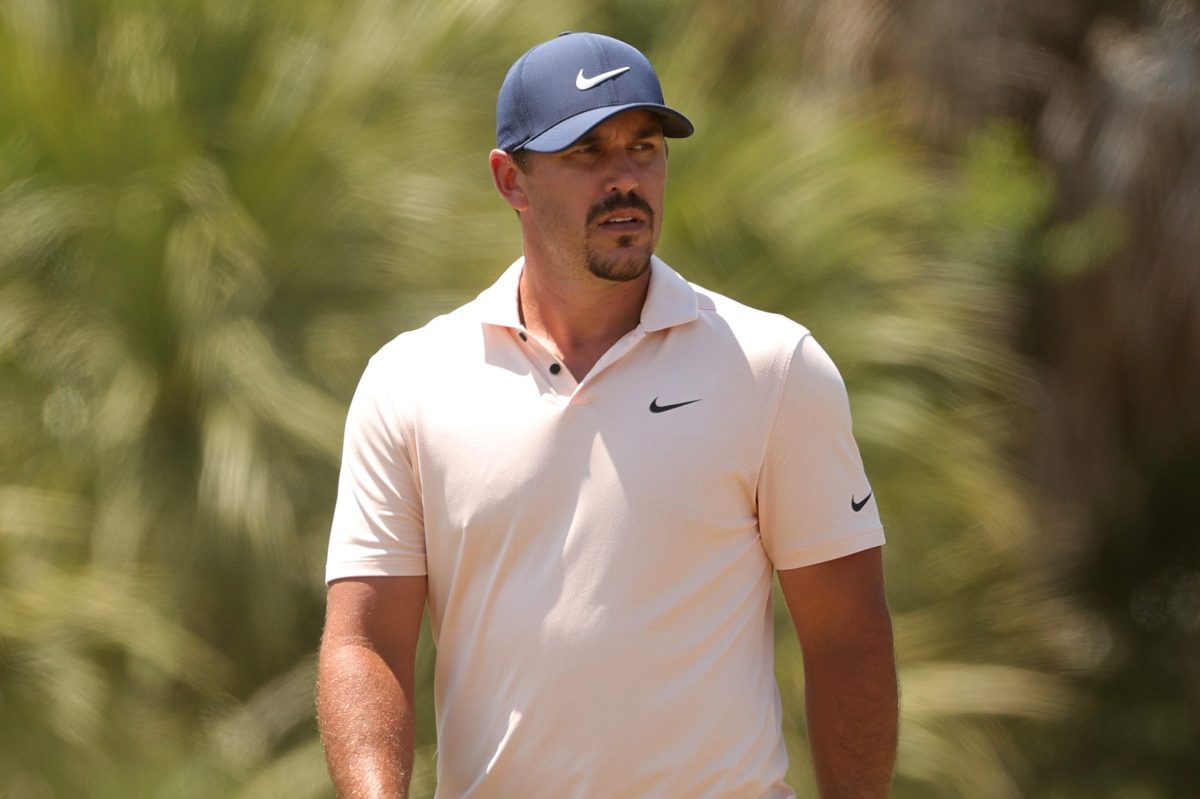 Professional golfer Brooks Koepka in a Nike hat and polo