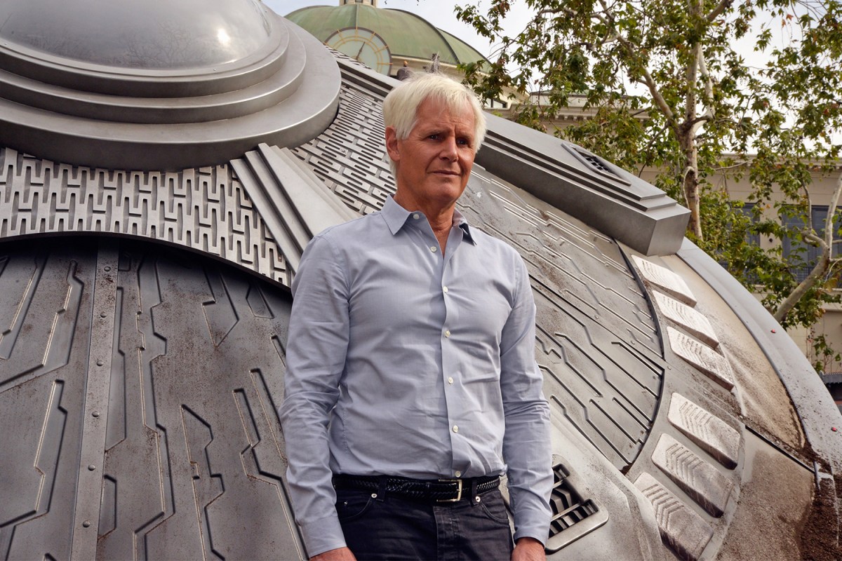 Executive Producer Chris Carter poses in front of a crashed UFO at a premiere episode screening of FOX's "The X-Files" at The Grove on January 22, 2016 in Los Angeles, California