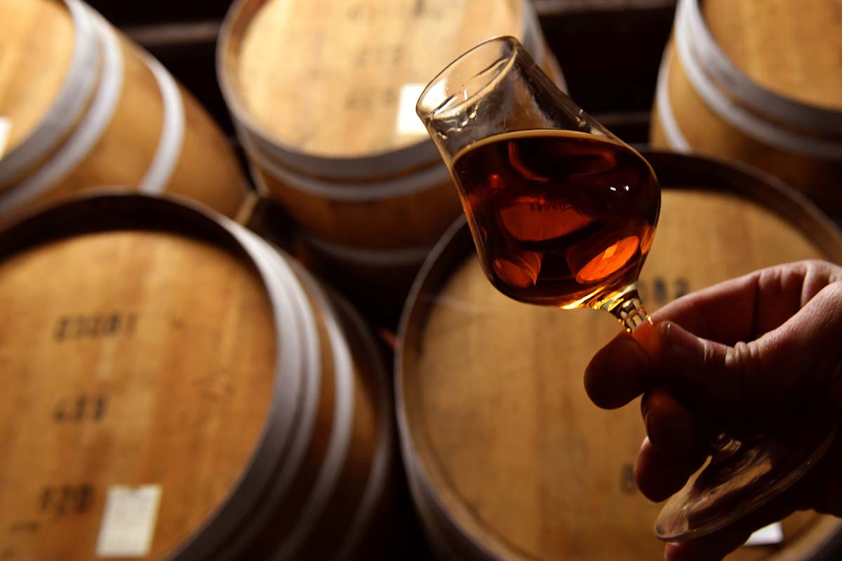 The cellar master checks the quality of an aged Armagnac at the Chateau Laubade, in Sorbets, near Eauze, in the department of the Gers, south western France, on February 9, 2021.