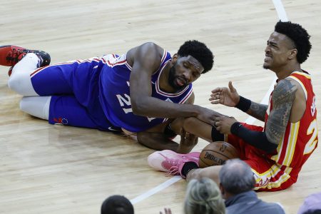 Joel Embiid falls on John Collins