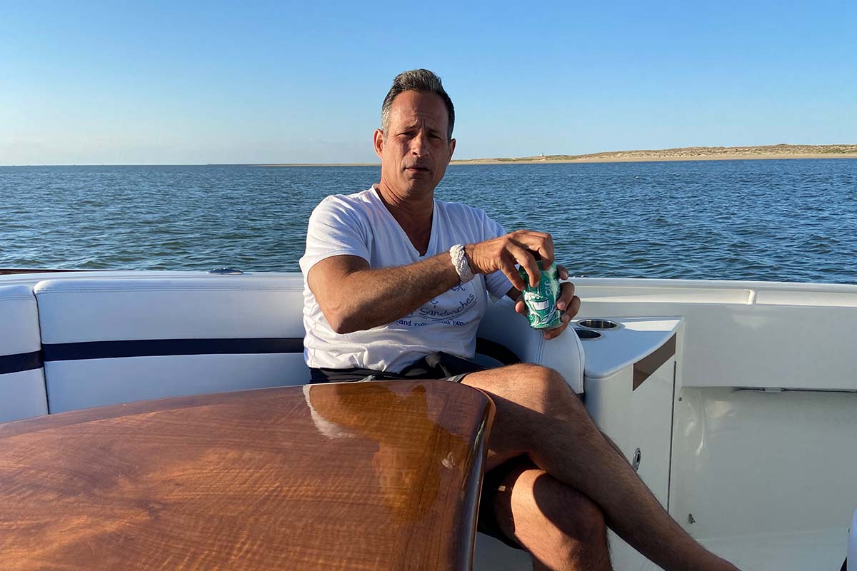 Dogfish Head founder Sam Calagione on a boat drinking SeaQuench Ale