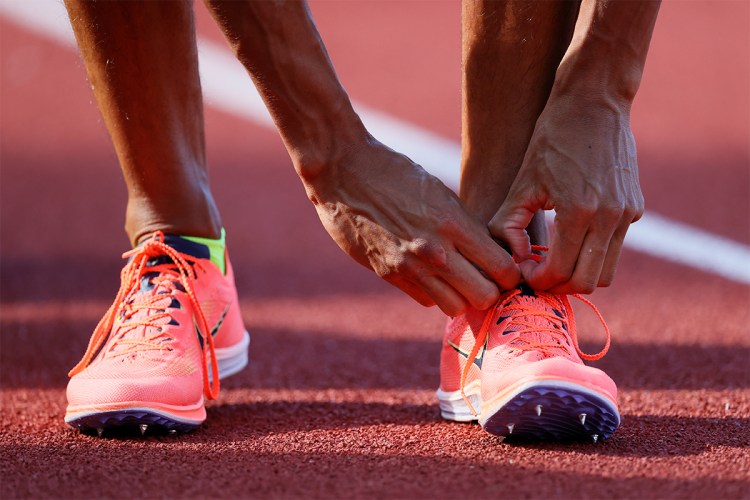 Nike Dragonfly track spikes being laced up