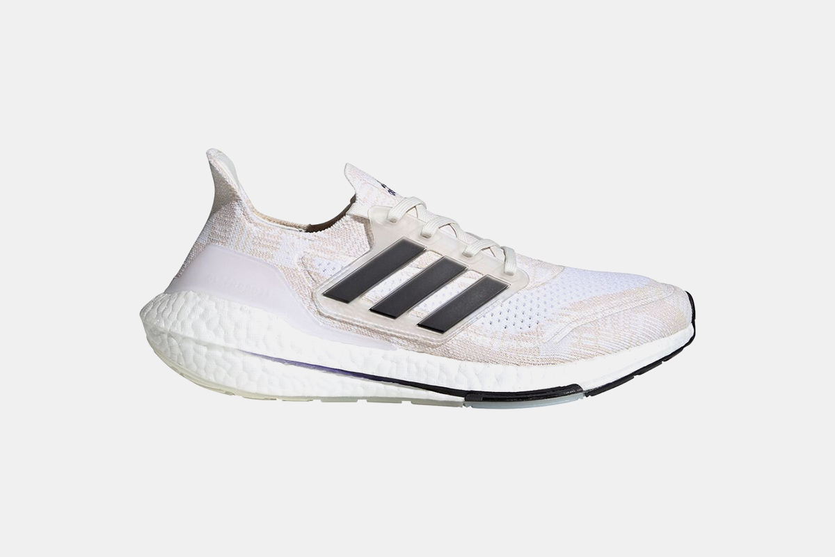 Adidas ultraboost 21 sneakers in a white and black colorway, great for energy return while running