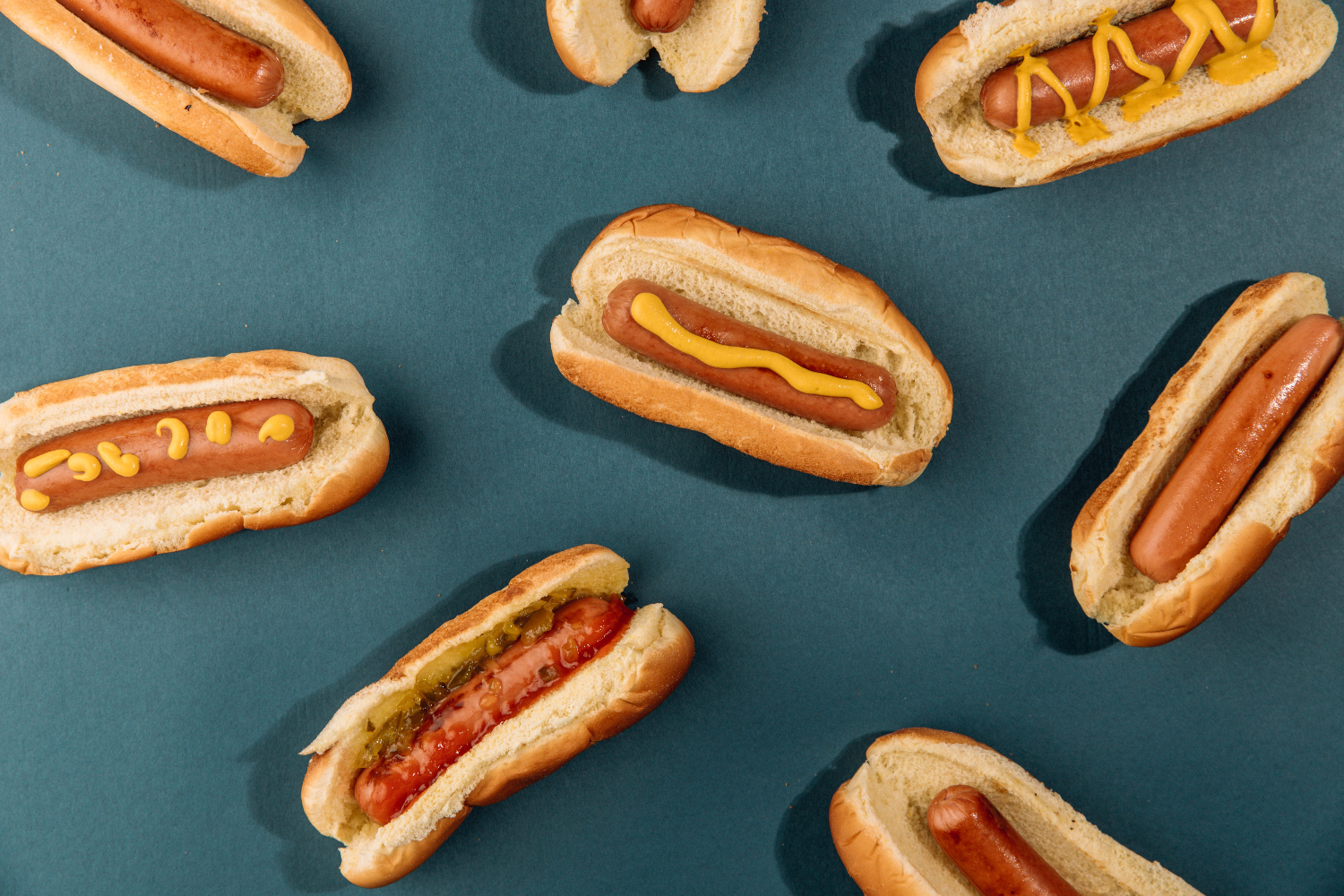 hot dogs on blue background