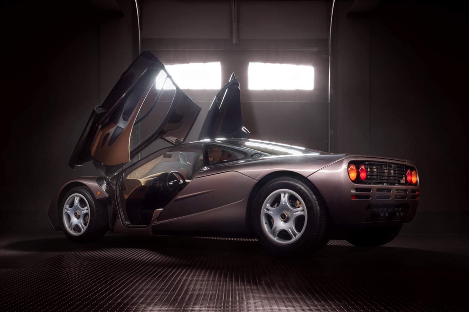 Butterfly doors opening on a 1995 McLaren F1, chassis 029, in Creighton Brown