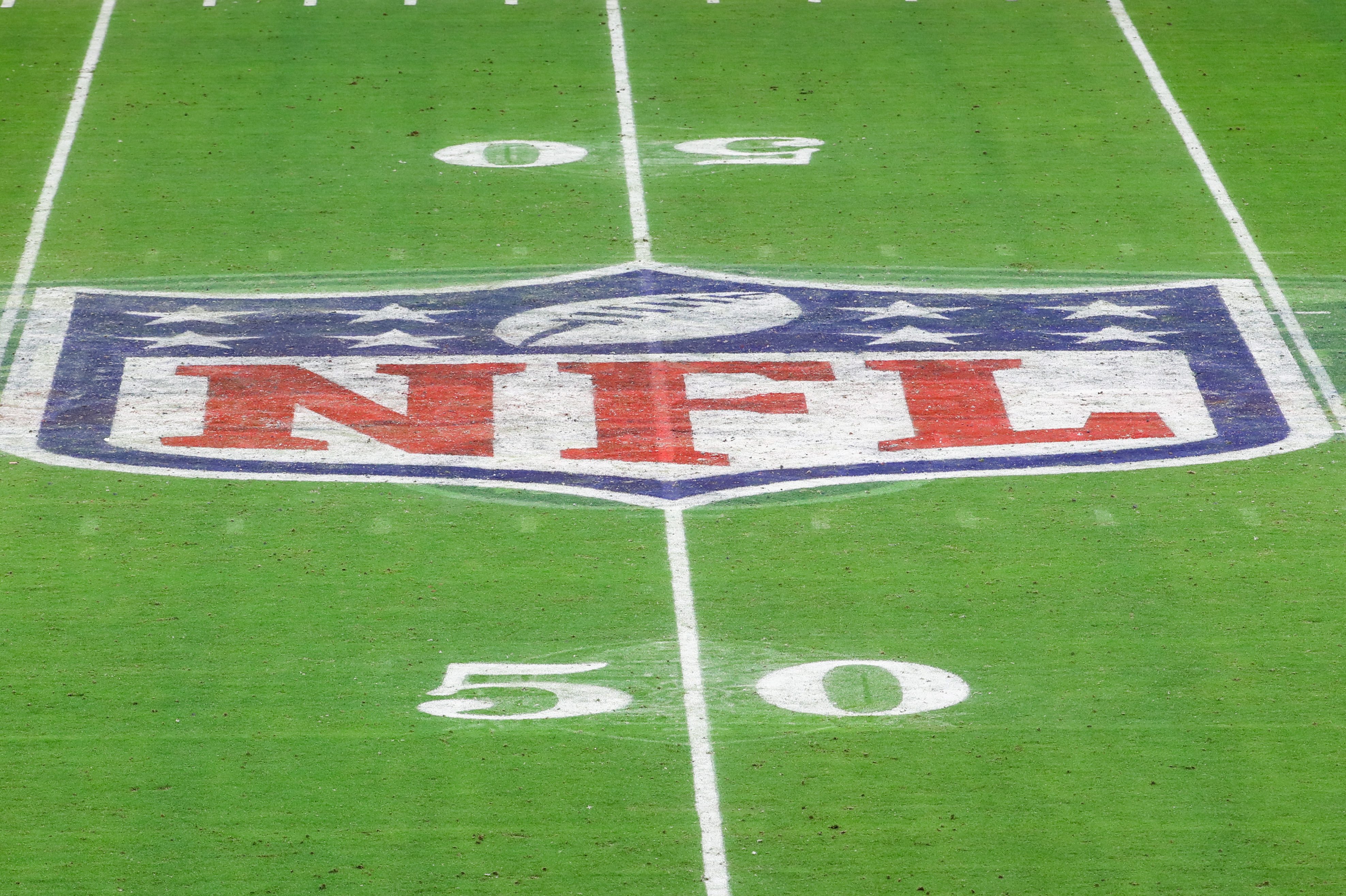 The NFL logo on the field of State Farm Stadium in. Arizona.