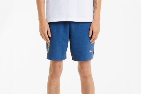 A man wearing Porsche Legacy Men's Sweat Shorts, now on sale at PUMA