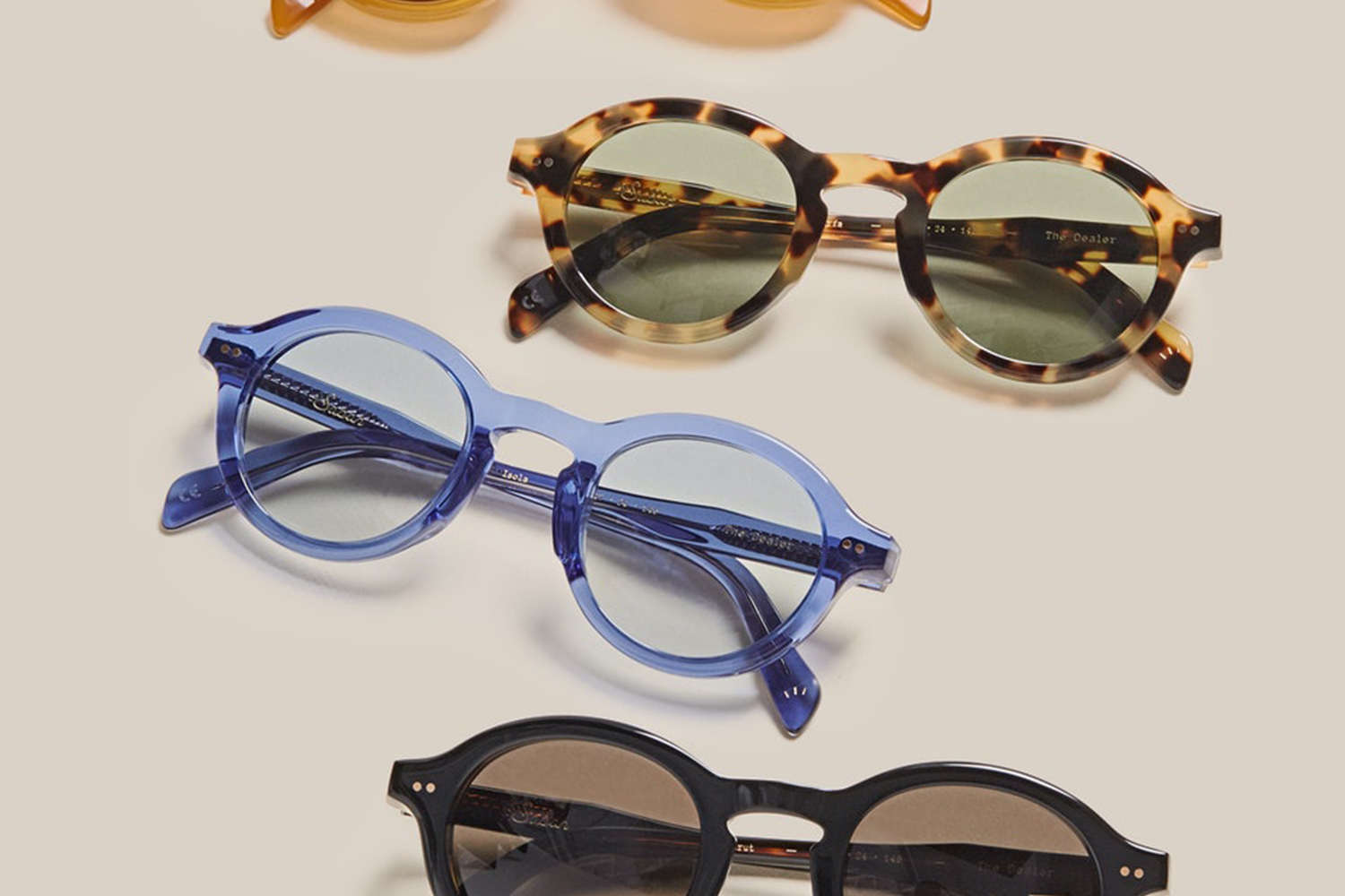 A variety of sunglasses from Sabah, a Turkish slip-on footwear brand that we love, arranged on a table