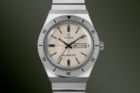 The new Q Timex watch collab from with Todd Snyder on a green background