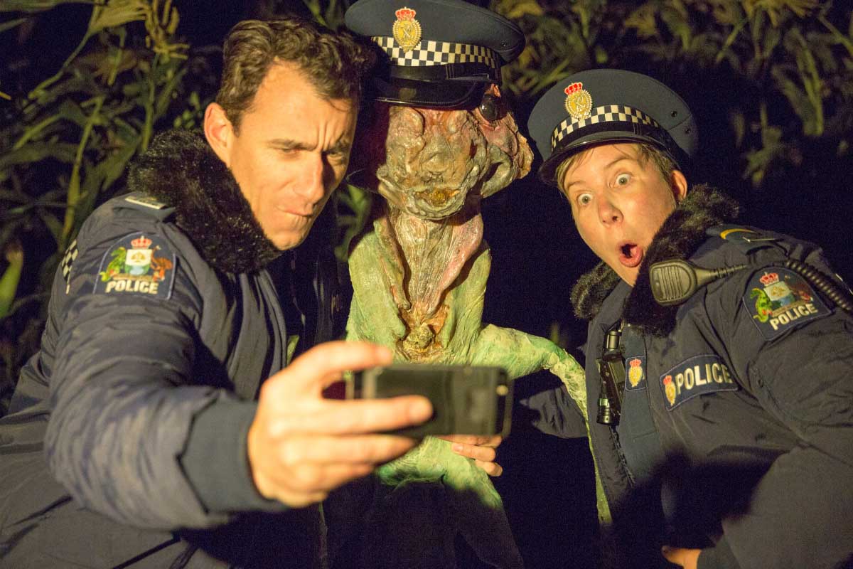 Mike Minogue as Officer Minoque, Extraterrestrial Flora, Karen O'Leary as Officer O'Leary in "Wellington Paranormal"