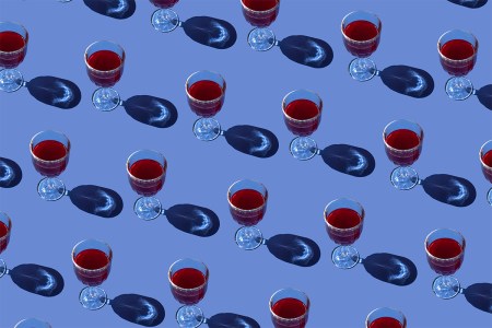 Red wine glasses on a purple background