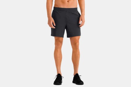 A man wearing a pair of Versatility Shorts from Rhone. Right now you can save $20 when you buy two pairs.