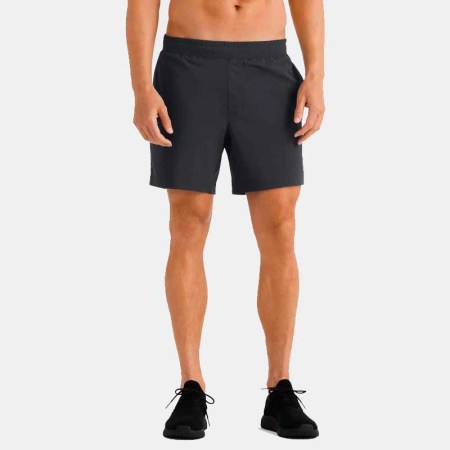 A man wearing a pair of Versatility Shorts from Rhone. Right now you can save $20 when you buy two pairs.