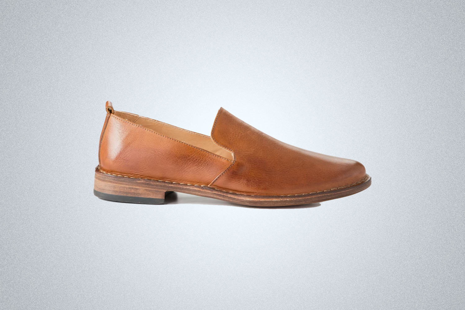 A pair of loafers from Astorflex on a grey background