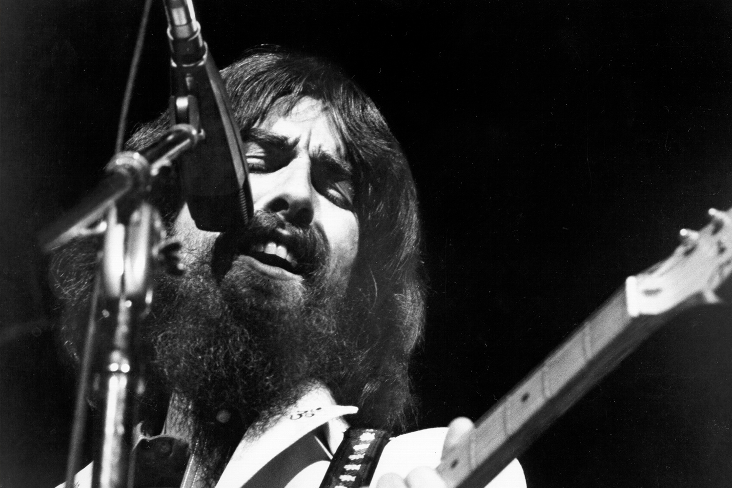 George Harrison performs onstage at the Concert for Bangladesh which was held at Madison Square Garden on August 1, 1971 in New York City