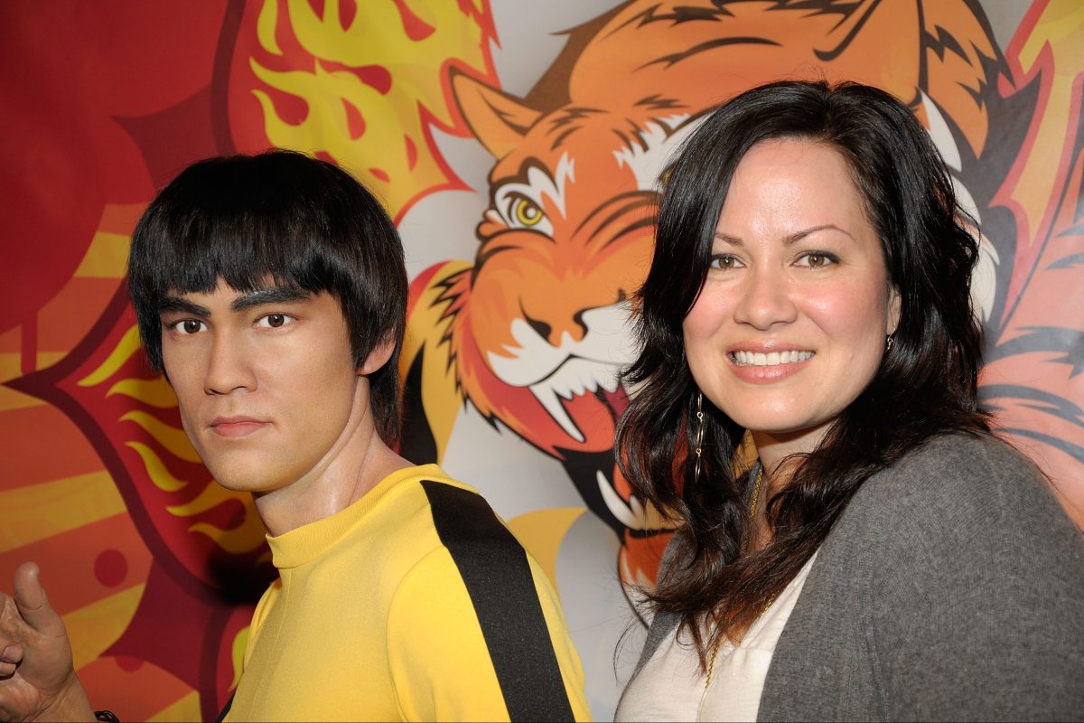 Shannon Lee with a wax statue of her father Bruce Lee at Madame Tussaud's Wax Museum in Hollywood, California
