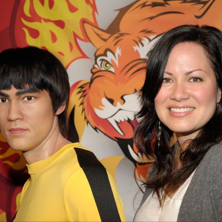 Shannon Lee with a wax statue of her father Bruce Lee at Madame Tussaud's Wax Museum in Hollywood, California
