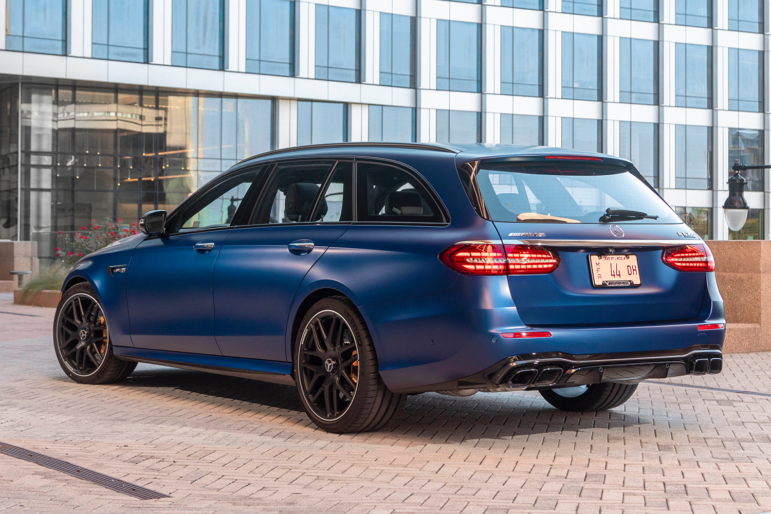 The rear end of a blue 2021 Mercedes-AMG E63 S 4MATIC Wagon. After test driving it for a week, we recommend the super fast station wagon.