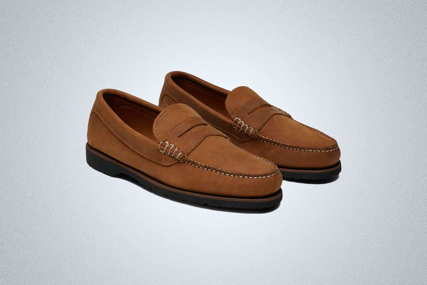 A pair of Summer Loafers from Quoddy on a grey background