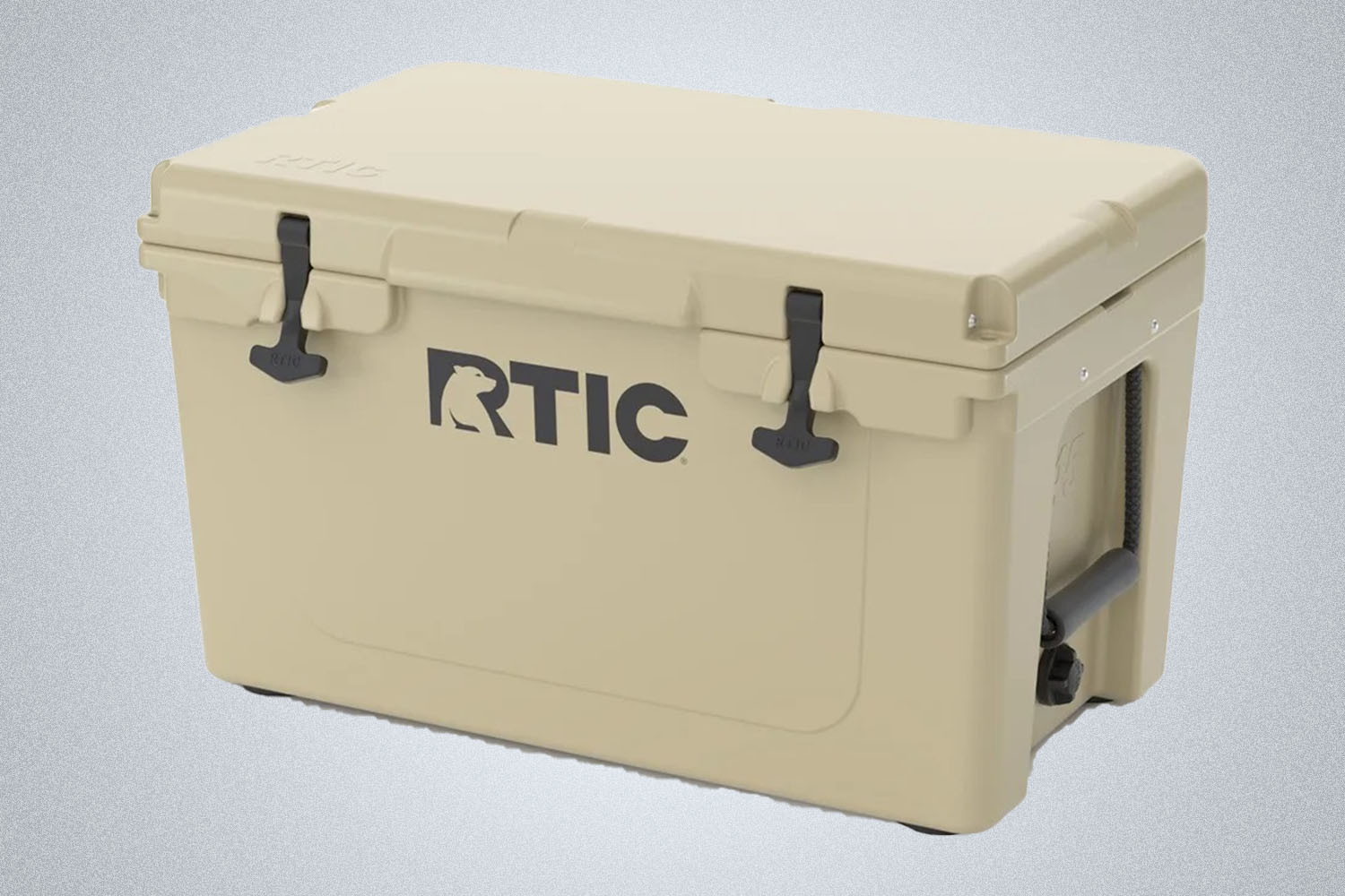 A biege RTIC 45 Hard Cooler  on a grey background 