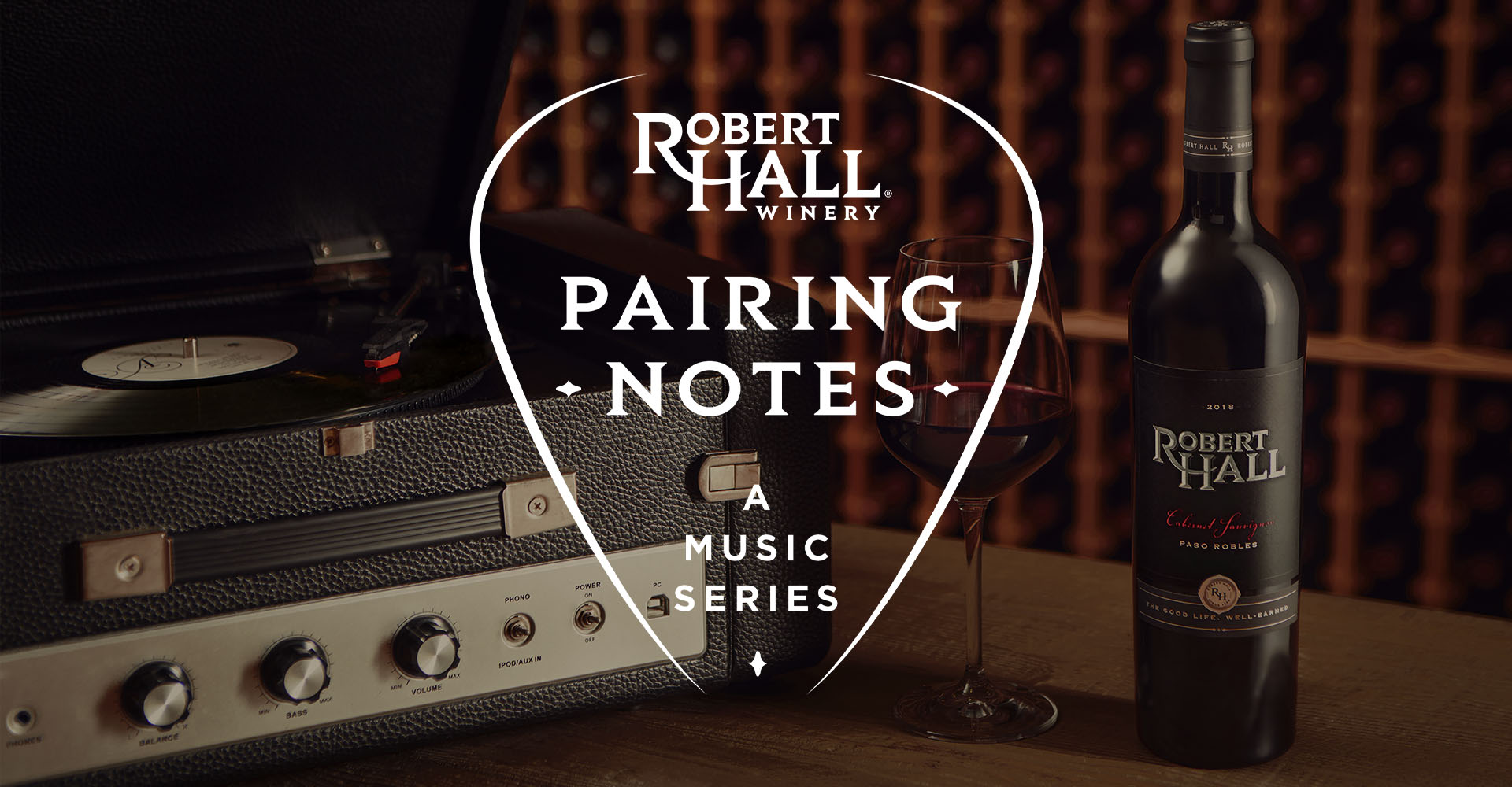 robert hall paring notes logo over a record player and a bottle of wine