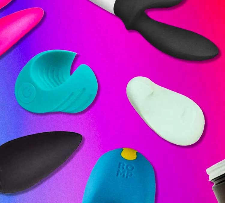 Various waterproof sex toys and vibrators on a purple background