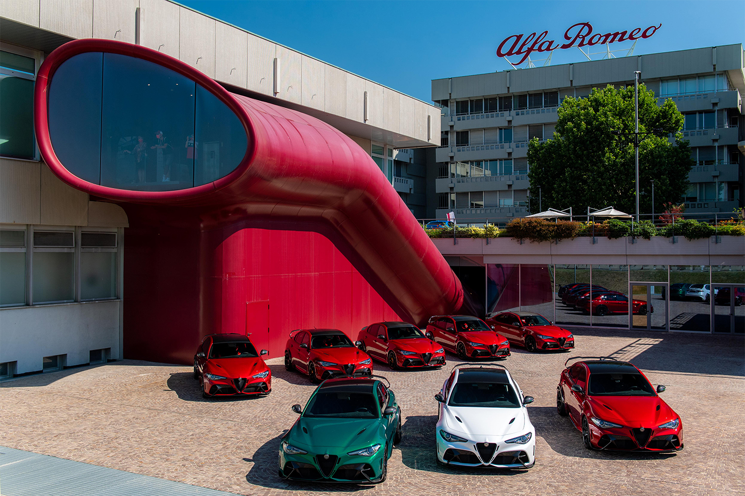 Alfa Romeo's vehicles lined up in red, green and white for the brand's 111th anniversary
