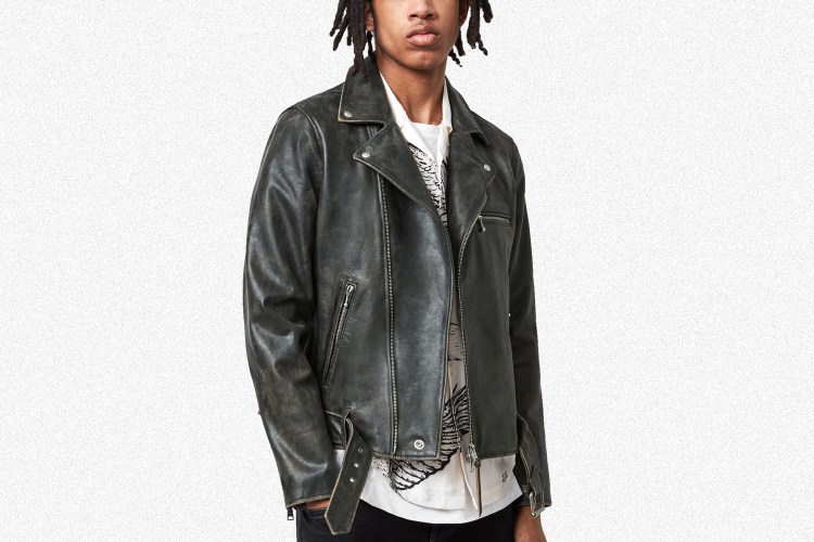 The Hank Biker Jacket in black from AllSaints. A model wears the jacket, which is 44% off during a July sale.