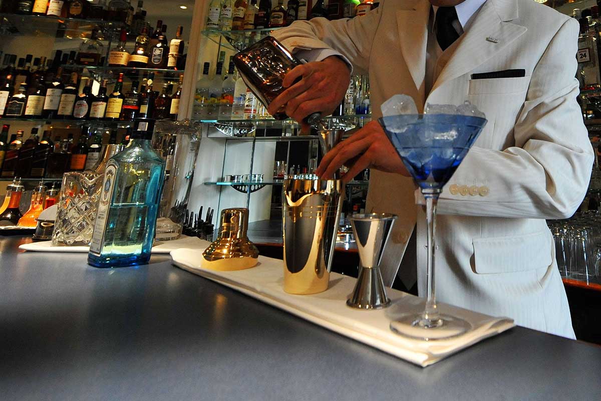 A barman mixes a cocktail in the American Bar in The Savoy Hotel in London, following a 3 year restoration of the hotel. For the first time, an American will run the bar