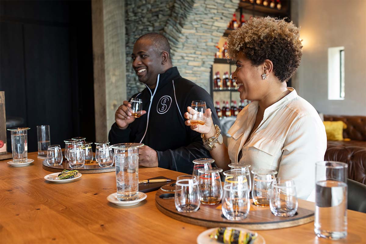 Armond and Samara Davis of the Black Bourbon Society, tasting whiskey. Their collaboration with Maker's Mark is a standout 2021 bourbon.