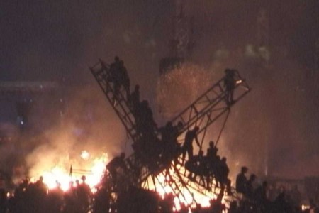 An image of burning stage or lighting rig from Woodstock 99, as shown on a new HBO documentary