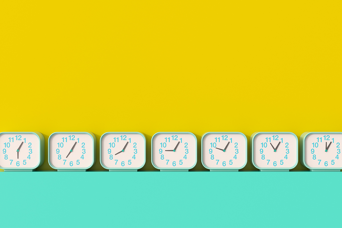 A series of seven clocks with different times lined up against a yellow and teal background