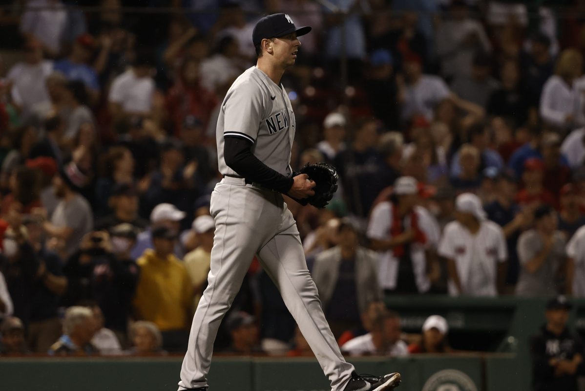 Brooks Kriske walks back to the mound after throwing a wild pitch. His performance led the New York Yankees to a loss against the Boston Red Sox.