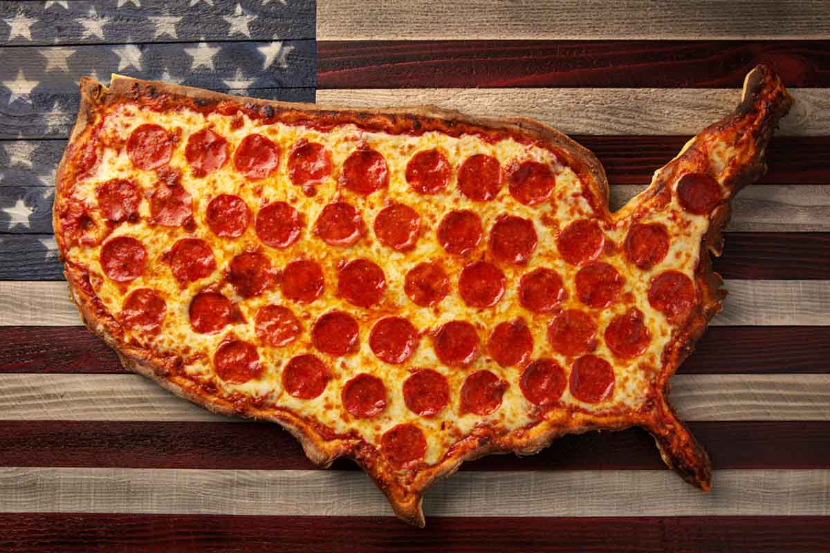"The United States of Pepperoni," a staged pizza photo in the shape of the U.S. behind the American flag