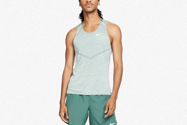 The Nike Dri-FIT ADV Techknit Ultra in green. The men's running tank is currently on sale for 50% off.