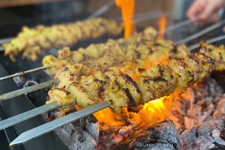 Roya's Persian chicken kabobs over an open flame