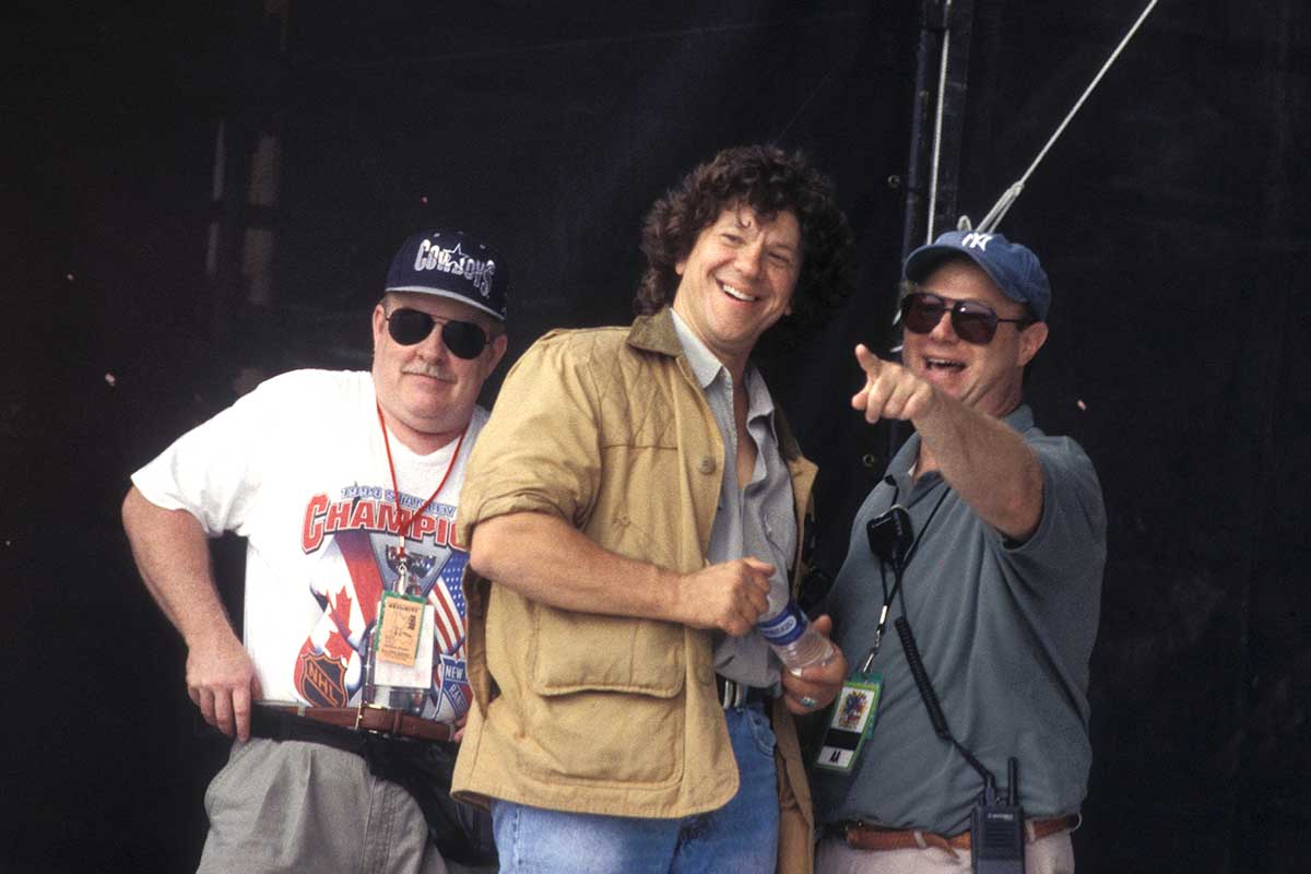 Woodstock creator and promoter Michael Lang and John Scher are shown on stage at Woodstock 99 in Rome, New York on July 24, 1999.