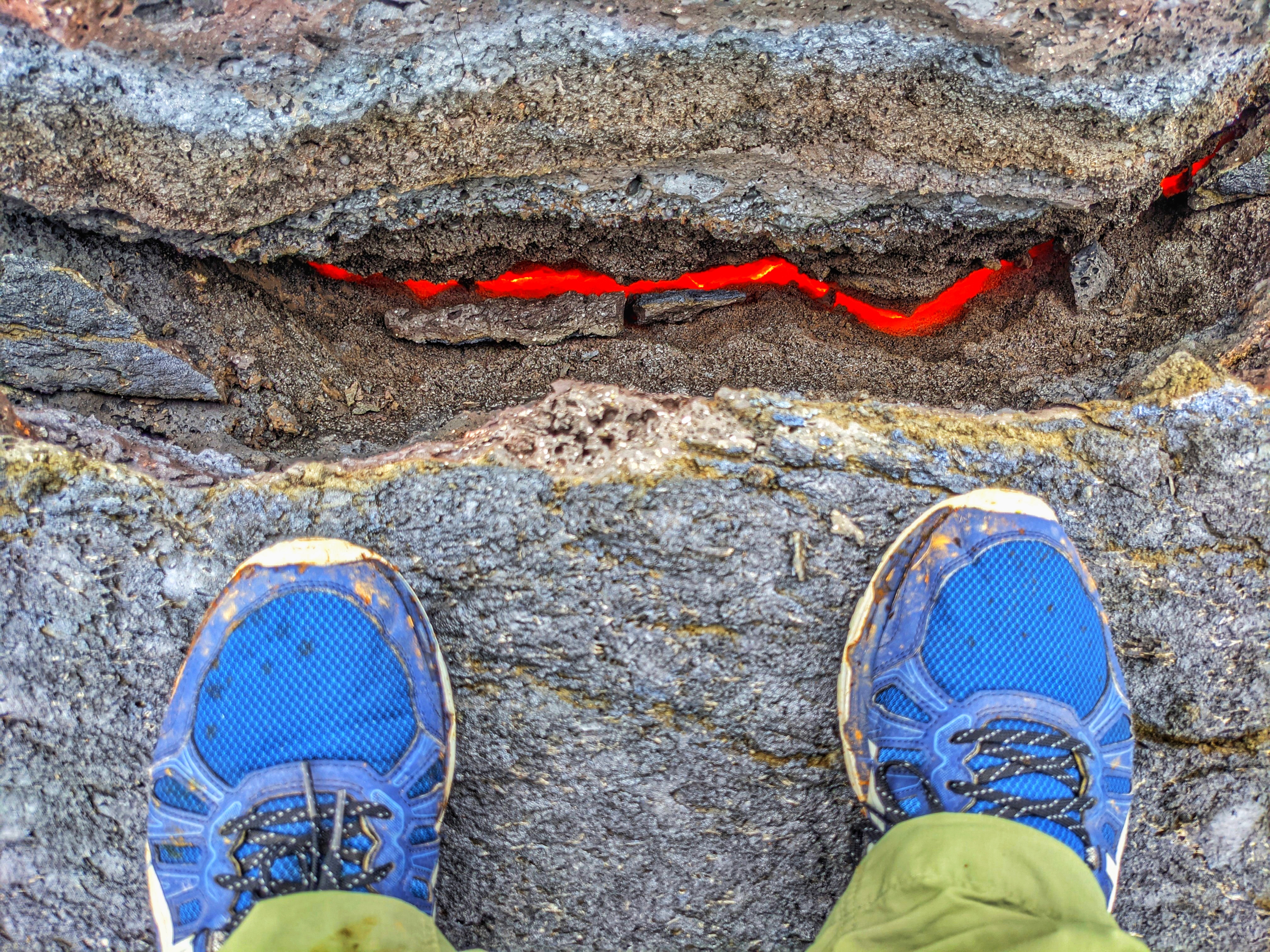Watching the lava flow underneath my feet at the Fagradalsfjall volcano in Iceland