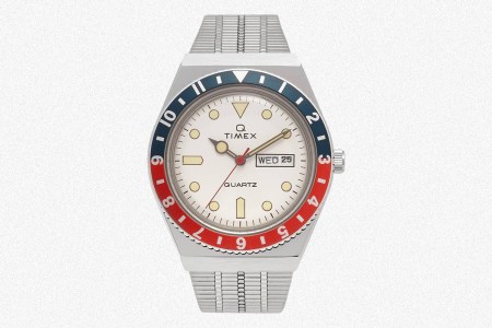 A white-dial Q Timex with a red and blue bezel. The quartz watch is on sale at End Clothing for 50% off.
